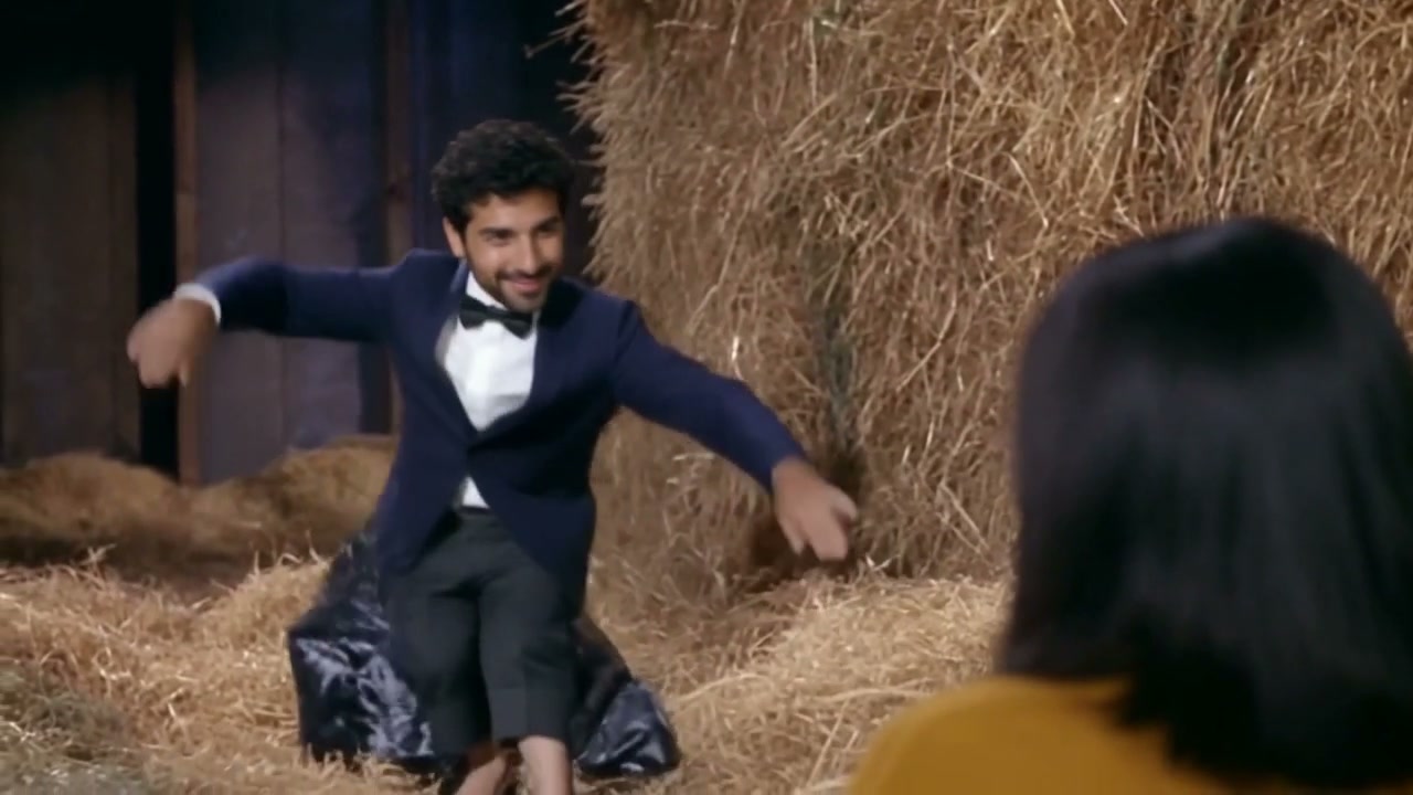 Frame from Tip Toe AI's actual sample showing an AI-generated dancer and observer in the barn